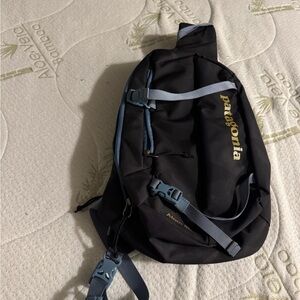 Patagonia Black Backpack with Blue Straps